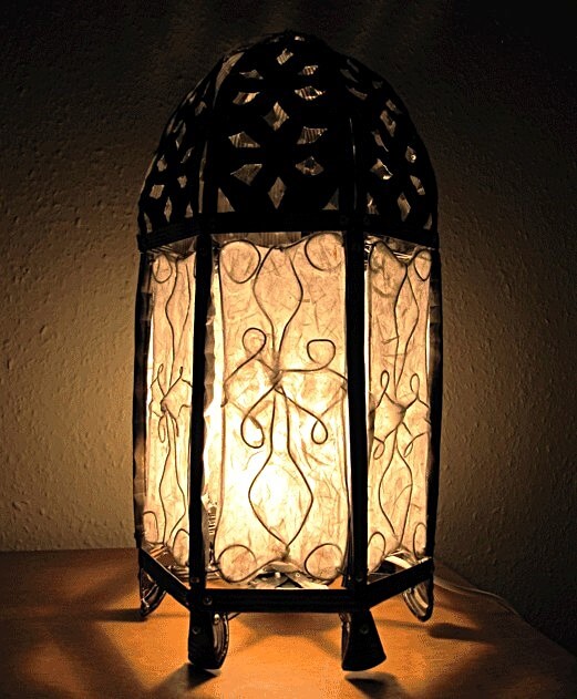 A photo of a Moroccan Style Lamp made of baked bean tins.